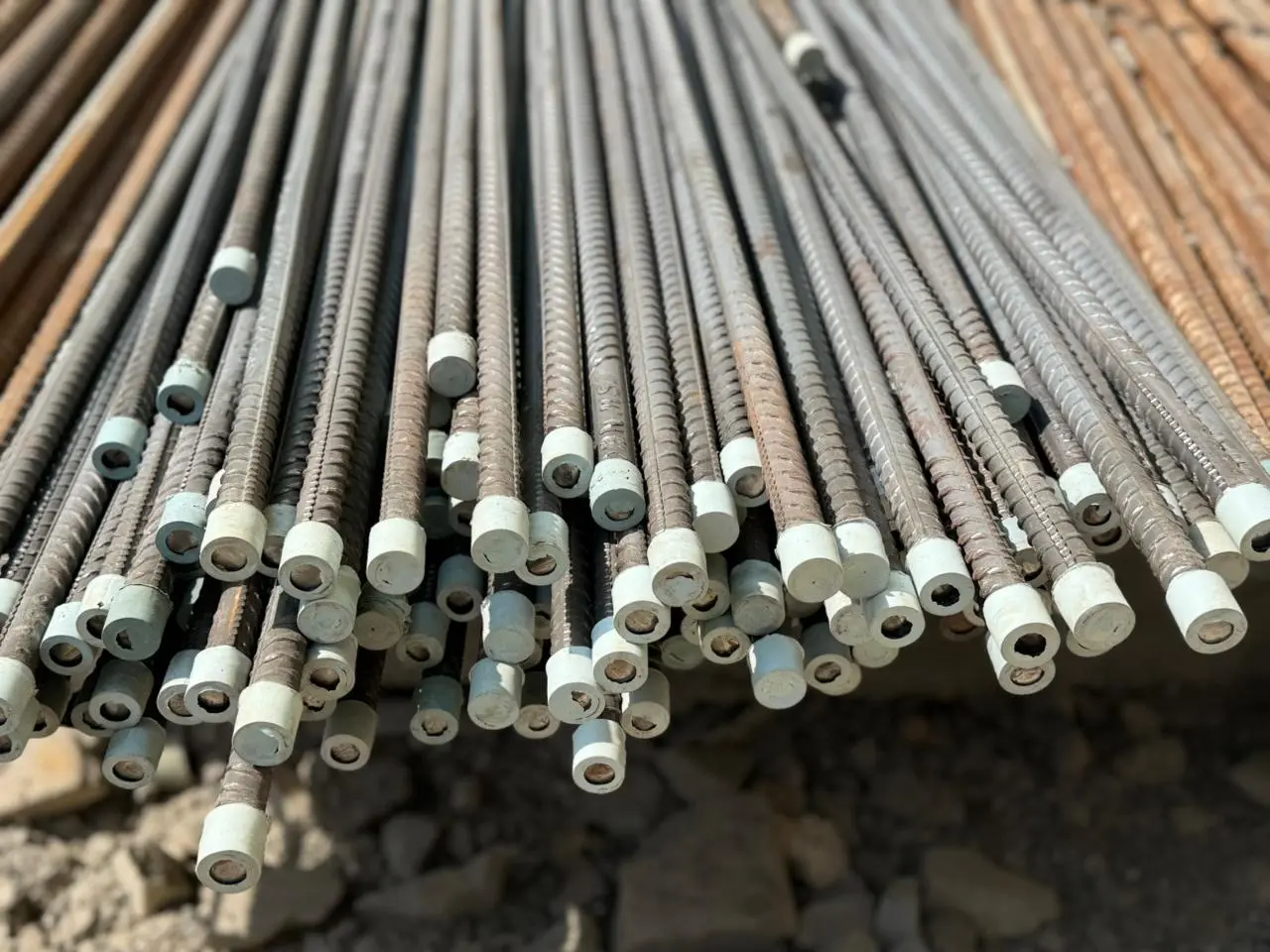 Prepared reinforcement bars with couplers installed and aligned for structural work